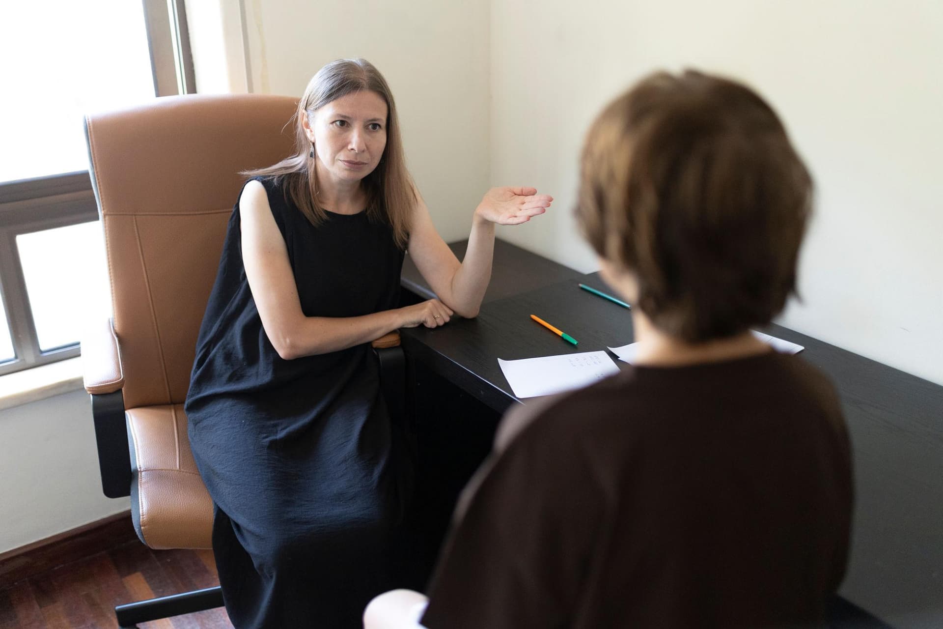NDIS psychology report template pages laid out with notes and clinical prompts