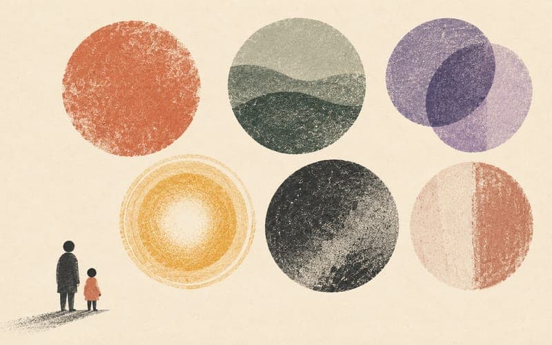 A parent and child facing six separate textured circular forms