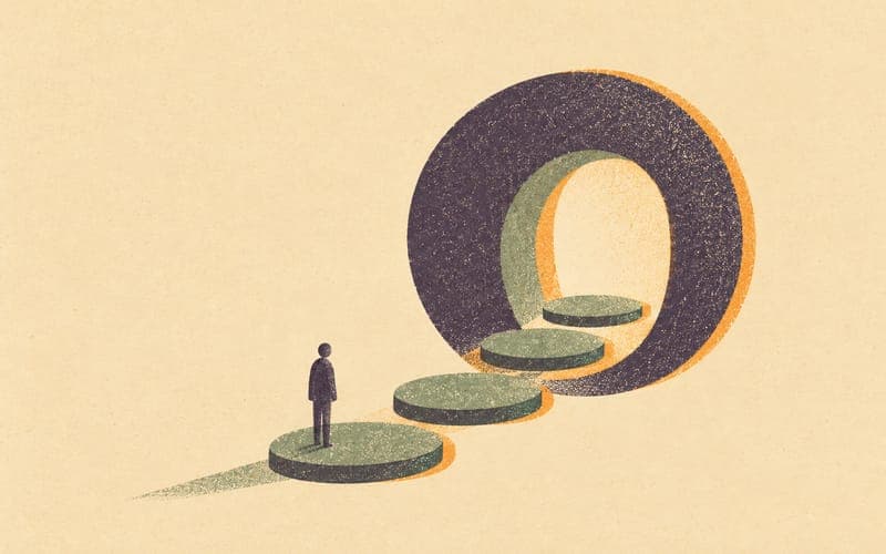 An open book beside an abstract hourglass form