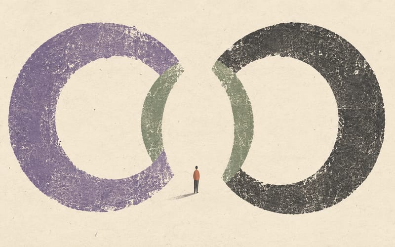 A tiny figure standing calmly within the shared space of two large open rings
