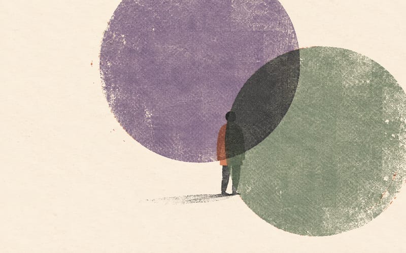 One small figure partly concealed by two offset translucent riso circles