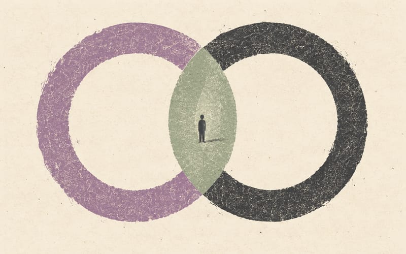 Two large contrasting circles sharing a narrow central space around a tiny figure